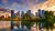 Sunset above city skyline of Calgary with Bow River, Alberta, Canada, photographed from Prince's Island Park
