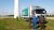 Lastwagen von Castrol vor Windkraftanlage mit mehreren Männern