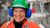 Woman wearing a hard hat and ear protectors