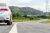 New silver car parking on the asphalt road in Thailand